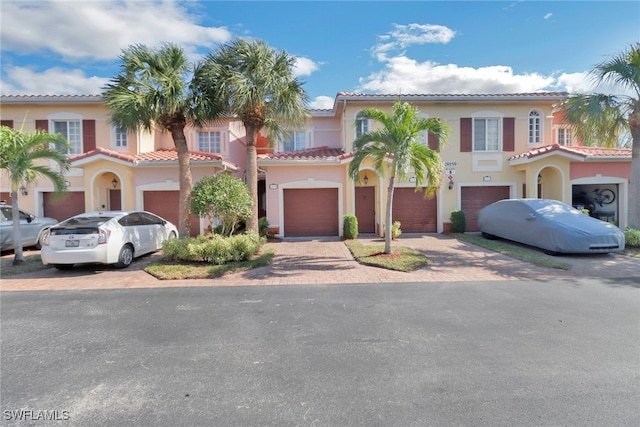 mediterranean / spanish-style home featuring a garage