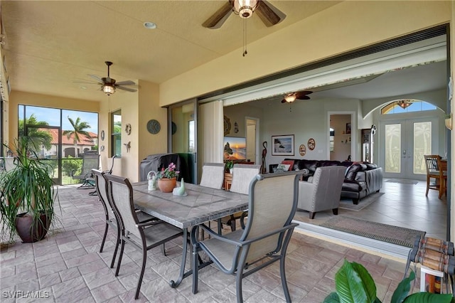 view of patio with ceiling fan and french doors