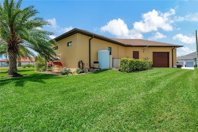 view of side of property featuring a yard