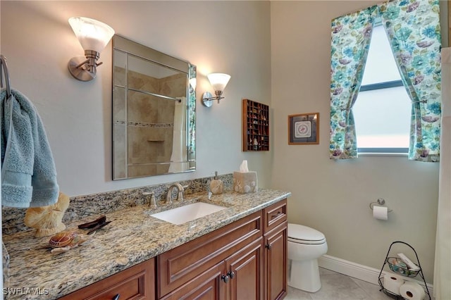 bathroom featuring tile patterned floors, toilet, vanity, and tiled shower