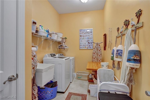 washroom featuring separate washer and dryer and light tile patterned flooring