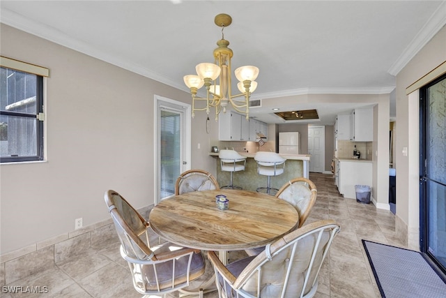 dining area featuring a notable chandelier, plenty of natural light, light tile patterned floors, and ornamental molding