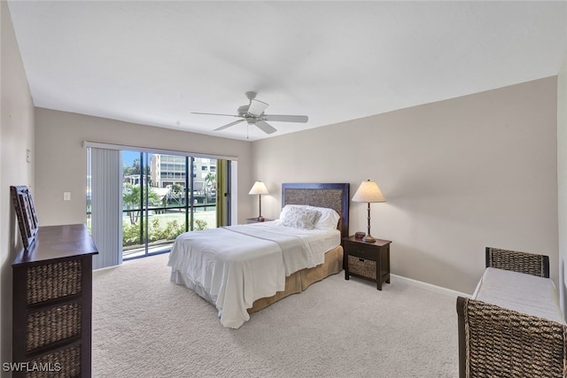 carpeted bedroom featuring ceiling fan and access to exterior