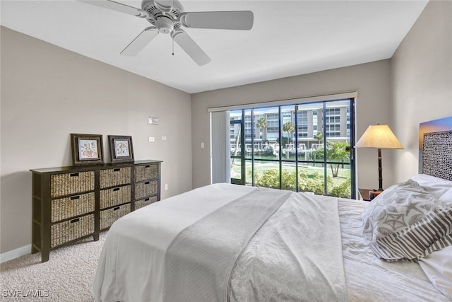 carpeted bedroom with access to outside and ceiling fan