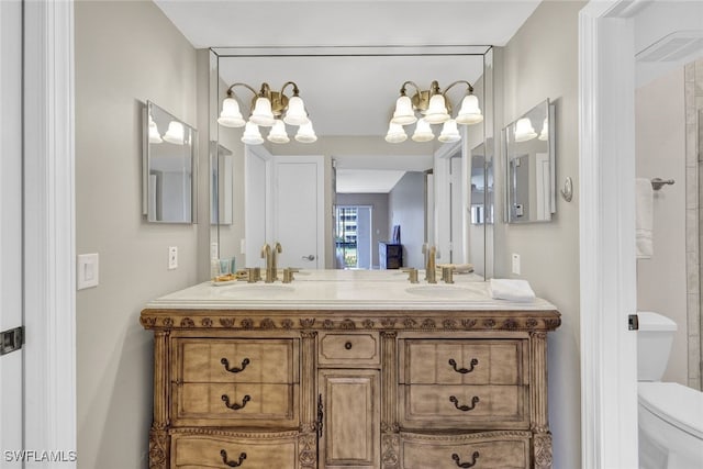 bathroom with vanity and toilet