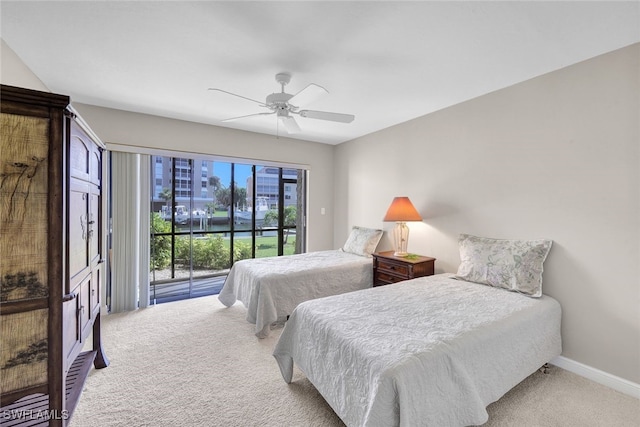 carpeted bedroom featuring access to outside and ceiling fan