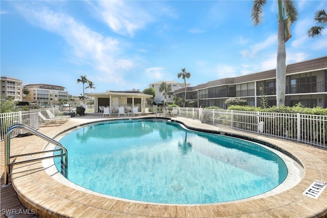 view of swimming pool with a patio