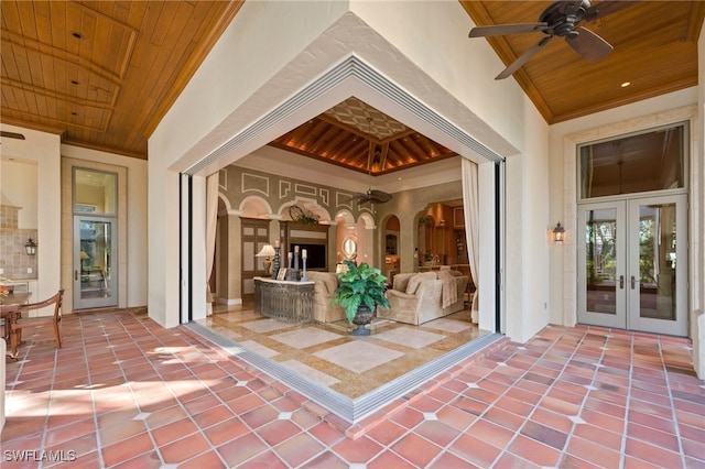 view of patio featuring french doors and ceiling fan