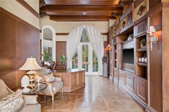 interior space featuring light parquet floors and beamed ceiling