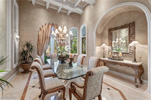 dining room featuring a notable chandelier and beam ceiling