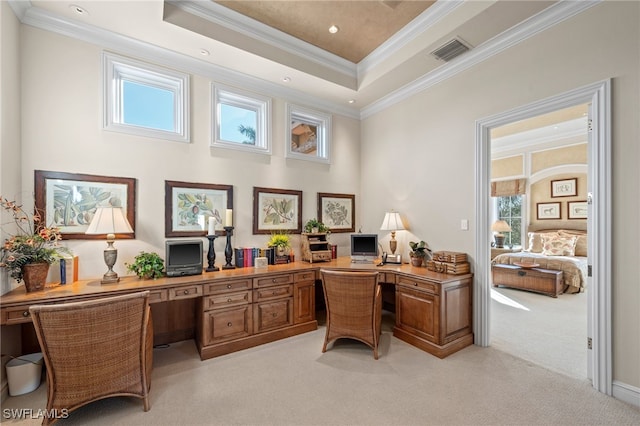 carpeted office space featuring crown molding and a towering ceiling