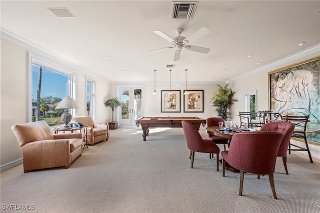 carpeted dining area with billiards, ornamental molding, and ceiling fan