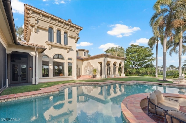 view of pool featuring a patio and french doors