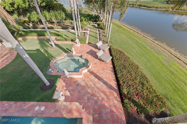 birds eye view of property with a water view