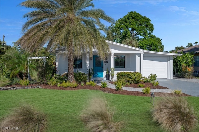 single story home with a garage and a front yard