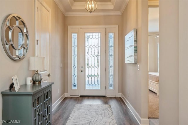 entryway featuring crown molding, dark hardwood / wood-style floors, and a notable chandelier