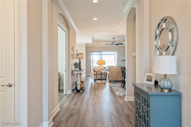 hall featuring ornamental molding and hardwood / wood-style floors