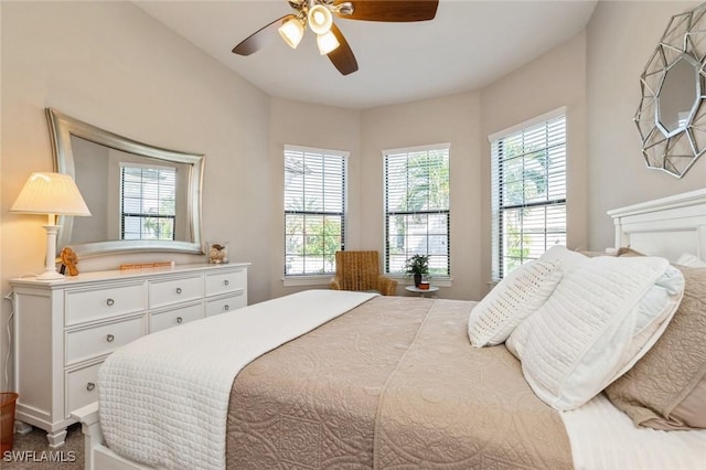 carpeted bedroom featuring ceiling fan