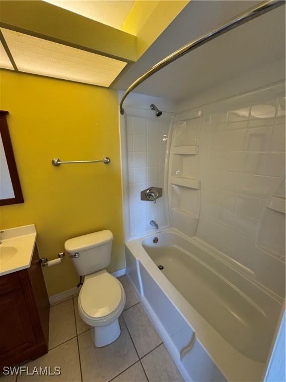 full bathroom with tile patterned floors, vanity, toilet, and shower / tub combination