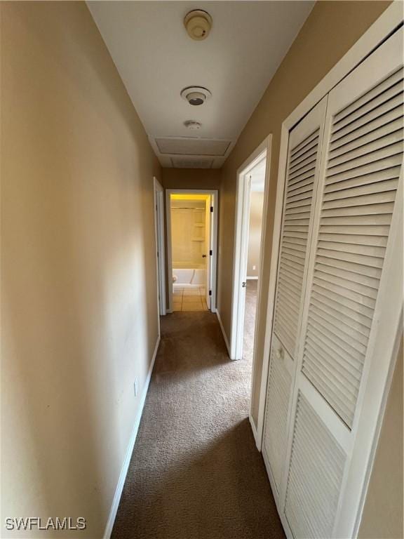 hallway with dark carpet