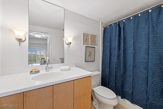 bathroom with vanity, walk in shower, and toilet