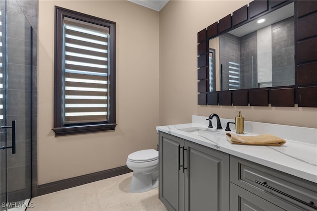 bathroom featuring toilet, a shower with door, tile patterned floors, and vanity