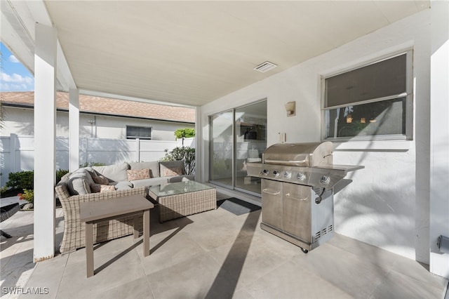 view of patio with outdoor lounge area, a grill, and fence