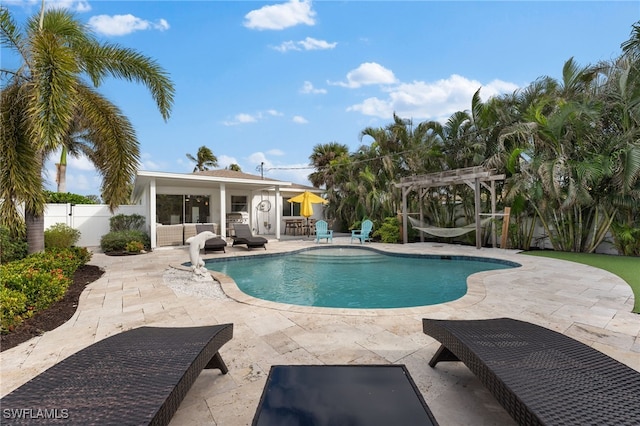 view of pool featuring a pergola, an outdoor living space, and a patio area