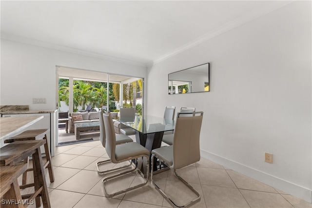 tiled dining room with crown molding