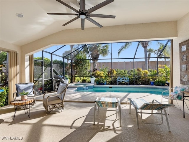 view of swimming pool featuring a patio and glass enclosure