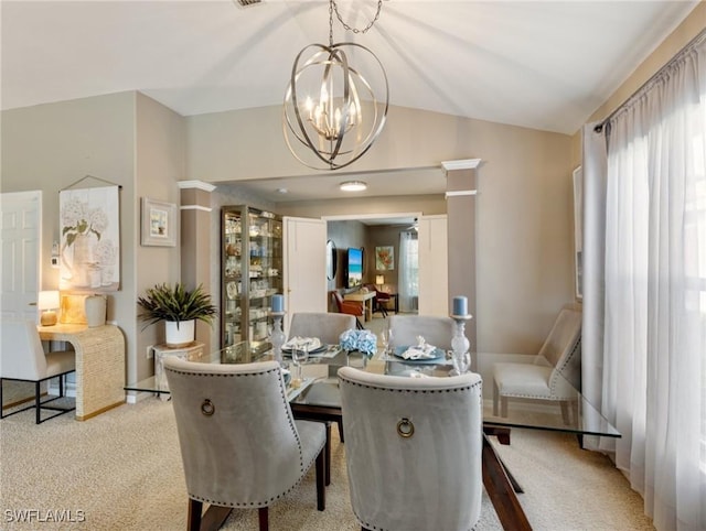 dining area featuring lofted ceiling, light colored carpet, and a notable chandelier