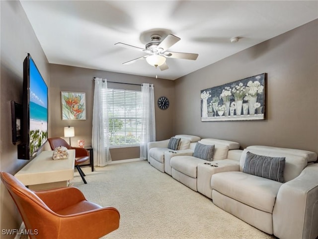 carpeted living room featuring ceiling fan