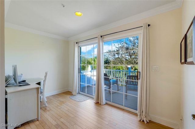 doorway to outside featuring crown molding and light hardwood / wood-style flooring