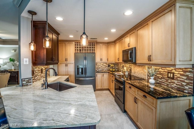 kitchen featuring sink, dark stone counters, pendant lighting, light brown cabinetry, and black appliances