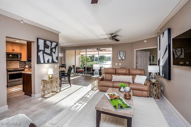 living room featuring ceiling fan and crown molding