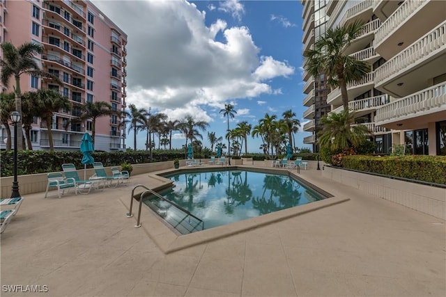 view of swimming pool featuring a patio