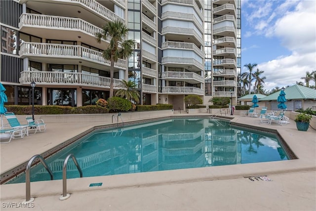 view of swimming pool featuring a patio area