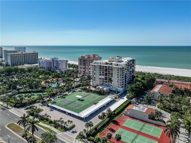 bird's eye view featuring a water view and a beach view