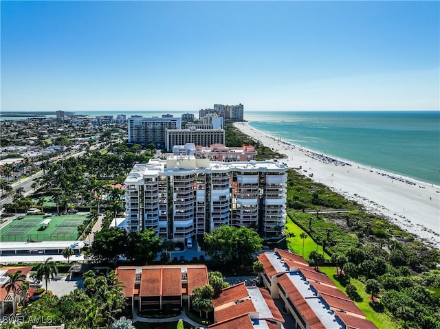 birds eye view of property featuring a water view and a view of the beach