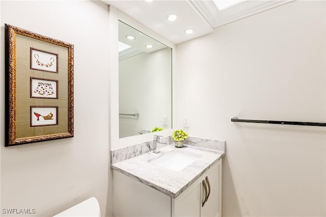 bathroom featuring vanity and ornamental molding