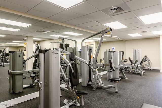 gym featuring a paneled ceiling