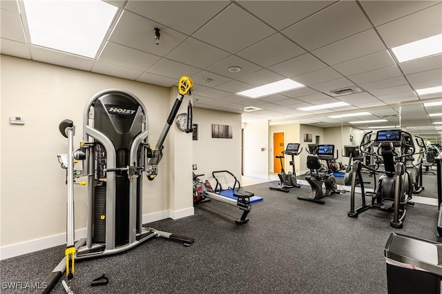 workout area featuring a paneled ceiling