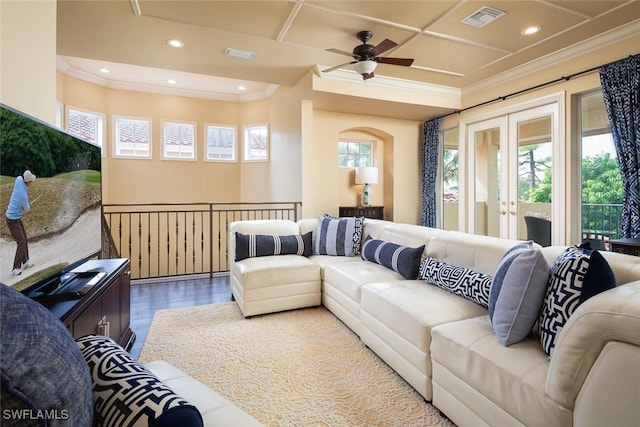 living room featuring ceiling fan, a healthy amount of sunlight, wood-type flooring, and french doors