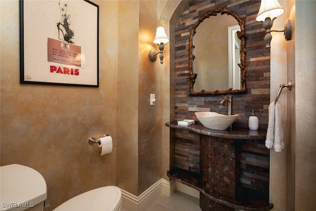 bathroom with tile patterned floors, toilet, and vanity