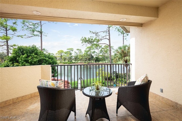 balcony featuring a water view