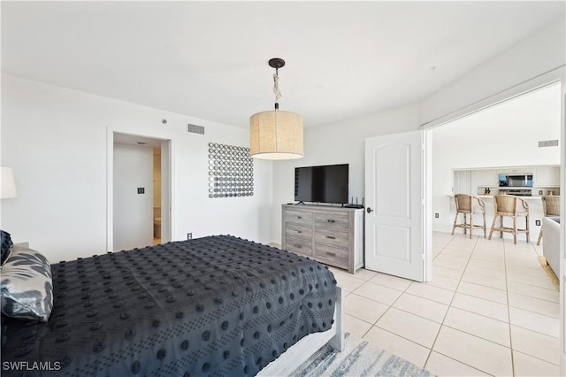 bedroom featuring light tile patterned floors