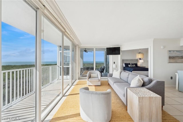 tiled living room featuring floor to ceiling windows and a wealth of natural light