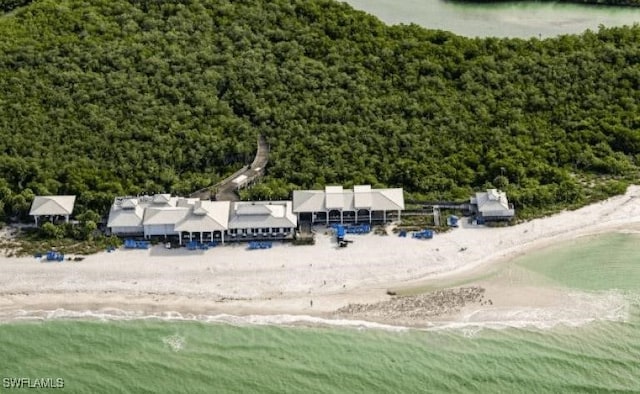 aerial view with a water view and a beach view