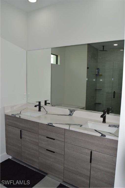 bathroom featuring vanity and walk in shower