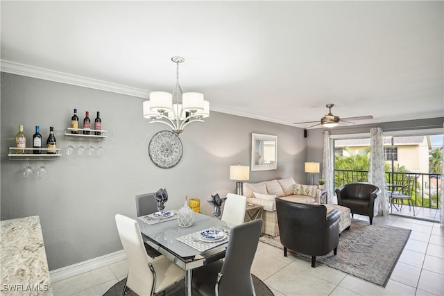 tiled dining room featuring ceiling fan with notable chandelier and ornamental molding